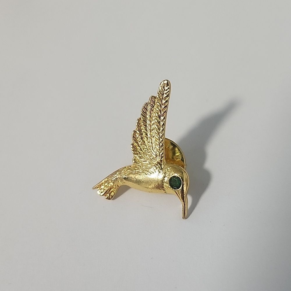 Elegant Gold Hummingbird Pin with Green Accent